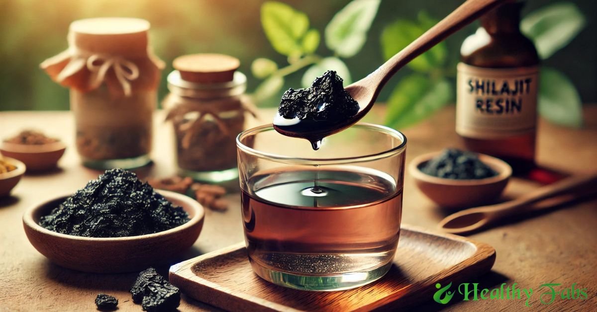 A spoon of Shilajit resin with warm water – Ayurvedic health remedy